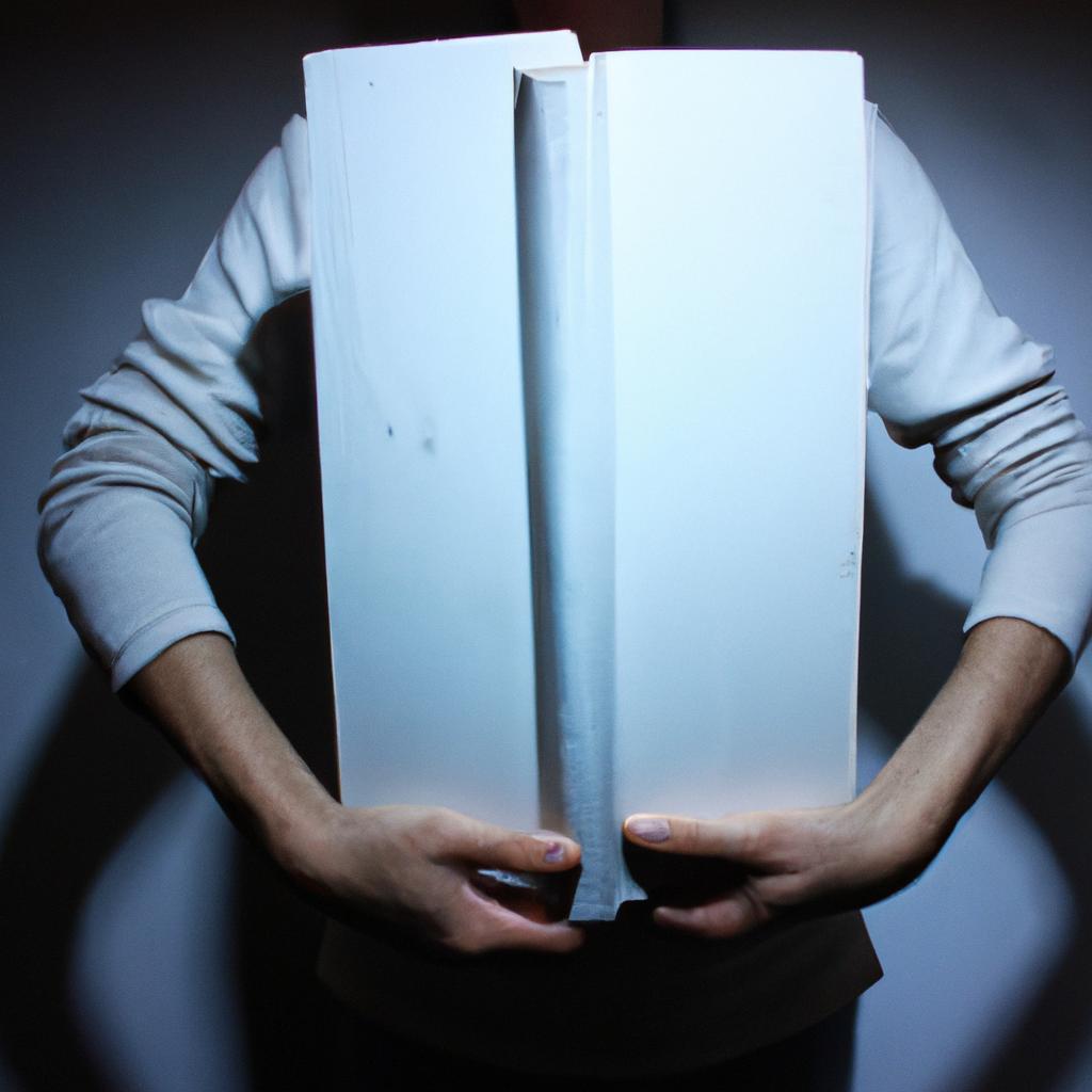 Person holding a large book